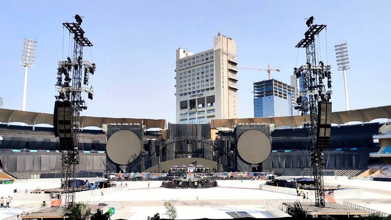 Coldplay Mumbai Music of the Spheres stage with circular screens and delay towers at DY Patil Stadium