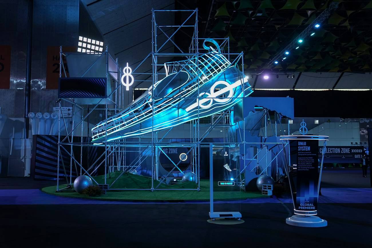 One8 neon sneaker brand sculpture built in scaffolding by VIDEAS