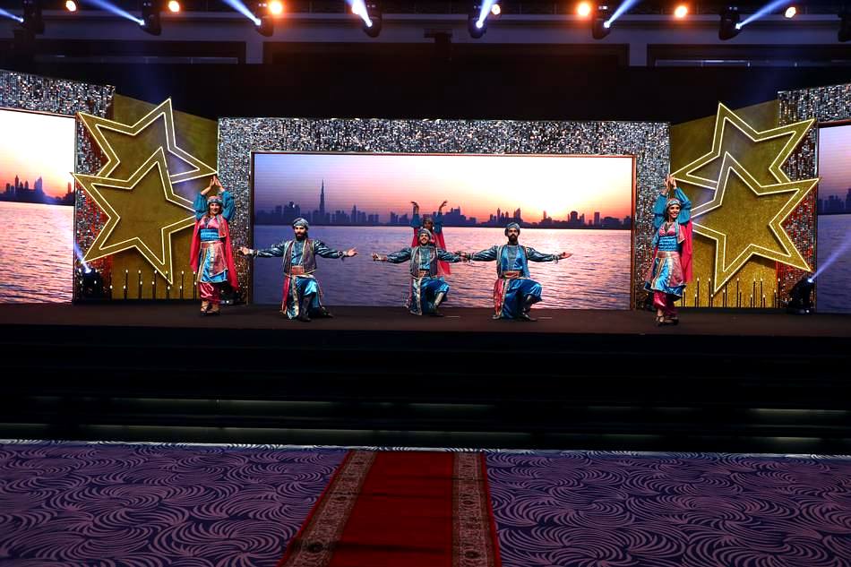 Corporate awards stage with Dubai skyline LED backdrop produced by VIDEAS